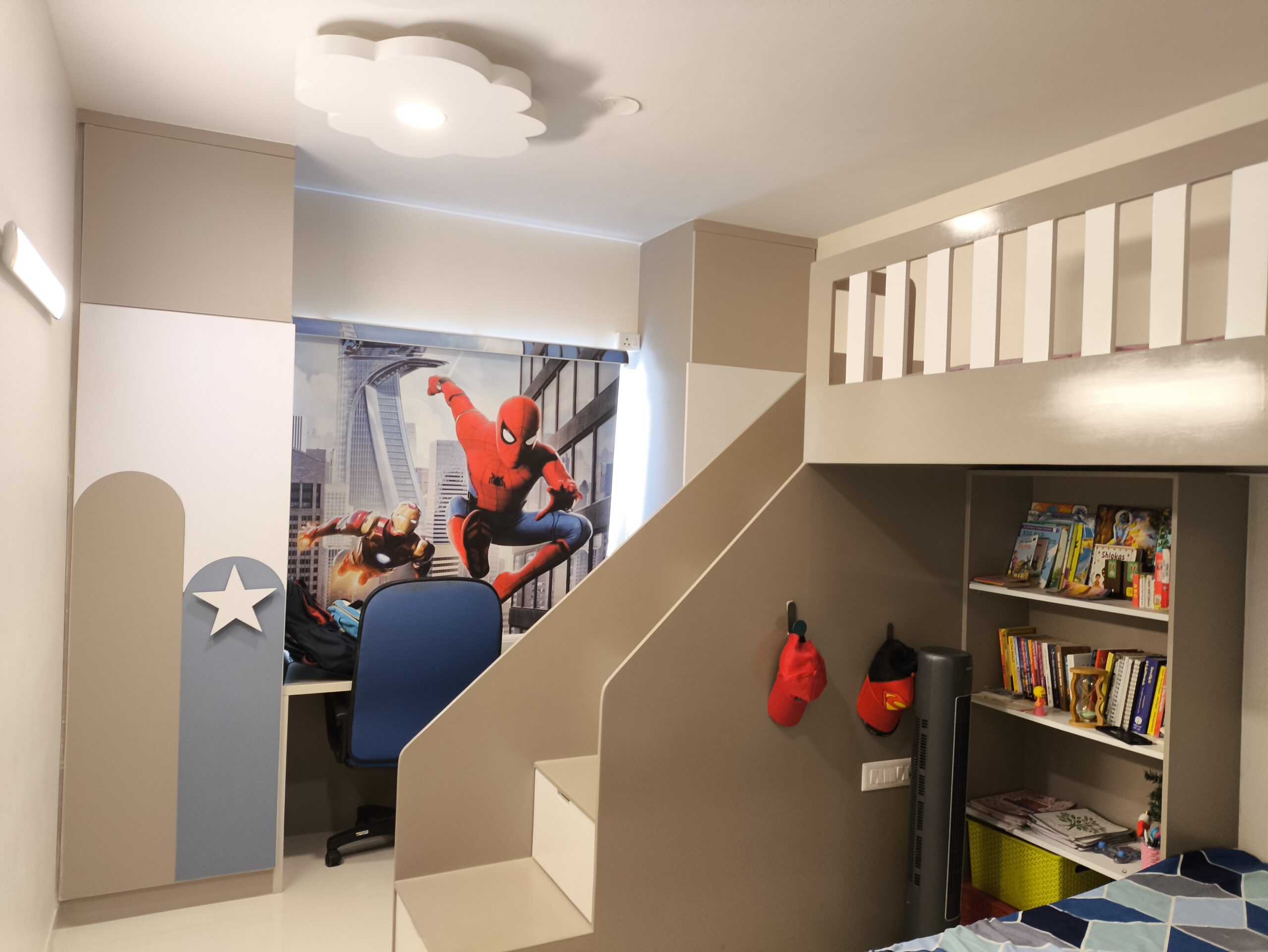 Modern-kids-room-design-with-Spiderman-wallpaper-accent-wall-and-compact-storage