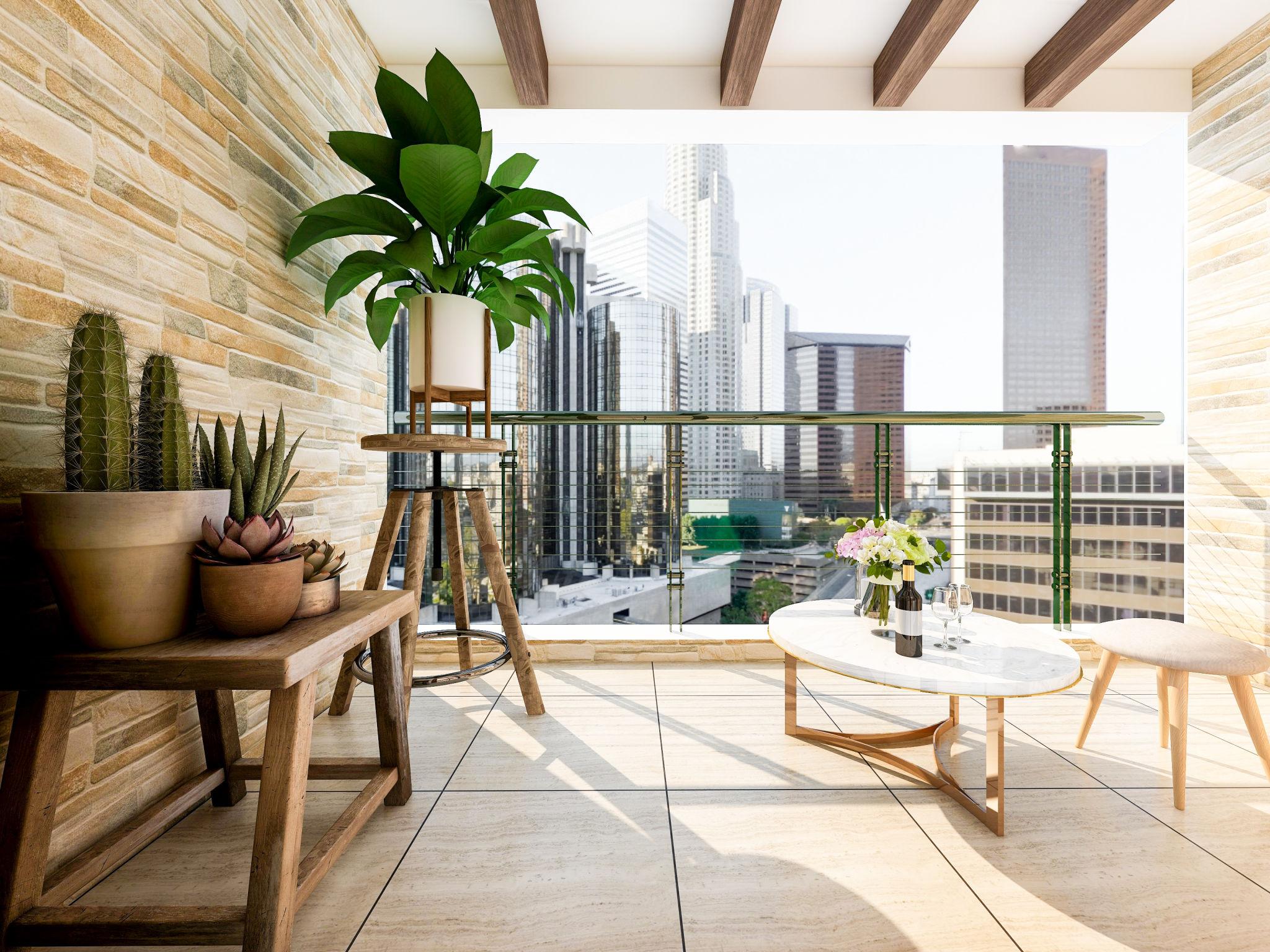 Multi-functional balcony used as workspace and relaxation corner in a modern apartment.